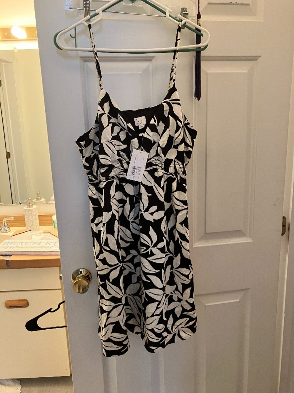 flowing sundress, black and white print, with adjustable straps.